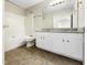 Spacious bathroom featuring a granite-topped vanity with ample storage and a tub-shower combo at 203 Canyon Lake Cir, Morrisville, NC 27560