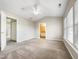A spacious bedroom with neutral paint, vaulted ceilings, and ensuite access at 203 Canyon Lake Cir, Morrisville, NC 27560
