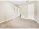 A sunlit bedroom with two doors offers possibilities for different decor and functionality at 203 Canyon Lake Cir, Morrisville, NC 27560