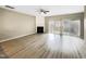 A spacious living room boasts hardwood floors, a fireplace, sliding glass doors, and recessed lighting at 203 Canyon Lake Cir, Morrisville, NC 27560
