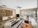 Bright living room featuring hardwood floors, fireplace, modern furnishings, and sliding glass doors to the backyard at 203 Canyon Lake Cir, Morrisville, NC 27560