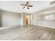 A bright and airy living room with light wood floors and a ceiling fan at 203 Canyon Lake Cir, Morrisville, NC 27560