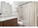 Bright bathroom featuring a marble countertop vanity, framed mirror, and subway-tiled shower and tub combo at 204 E Murray Ave, Durham, NC 27704