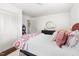 Spacious bedroom with a closet, view of an adjacent room, hardwood floors, and bright natural light at 204 E Murray Ave, Durham, NC 27704