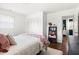 Bedroom with hardwood floors, closet, patterned bedspread, and bright natural light at 204 E Murray Ave, Durham, NC 27704