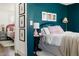 Serene bedroom featuring a plush bed, colorful accents, and decorative wall art at 204 E Murray Ave, Durham, NC 27704