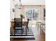 Inviting dining room boasts hardwood floors, contemporary lighting, and a view to the backyard at 204 E Murray Ave, Durham, NC 27704