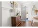 Inviting entryway with an antique dresser, stylish lighting, and a view of the front door at 204 E Murray Ave, Durham, NC 27704