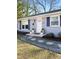 Charming single-story home featuring decorative stone walkway, and a freshly painted exterior at 204 E Murray Ave, Durham, NC 27704