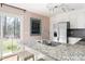 Open kitchen with granite countertops, stainless steel appliances, and view to the backyard at 204 E Murray Ave, Durham, NC 27704