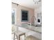 Modern kitchen island features granite countertops and bar seating with a view of the backyard at 204 E Murray Ave, Durham, NC 27704