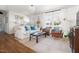 Bright living room features hardwood floors, comfortable seating, and large windows offering natural light at 204 E Murray Ave, Durham, NC 27704