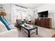 Well-lit living room offering a comfortable seating area and a media center for entertainment at 204 E Murray Ave, Durham, NC 27704