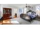 Charming bedroom featuring a unique metal bed frame, hardwood floors, and a classic wooden dresser at 206 S Salem St, Apex, NC 27502