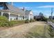 Wide angle view of the exterior with a beautiful yard and inviting porch at 206 S Salem St, Apex, NC 27502