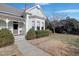 Beautiful home with a bay window, light green siding, and a well-kept lawn at 206 S Salem St, Apex, NC 27502