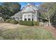 Beautiful home featuring an interesting roofline, and well-maintained landscaping and lawn at 206 S Salem St, Apex, NC 27502