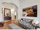 Bright foyer with hardwood floors, a patterned sofa, and striking crayon art at 206 S Salem St, Apex, NC 27502