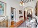 Traditional foyer with high ceilings, an ornate chandelier, hardwood floors, and an area rug at 206 S Salem St, Apex, NC 27502