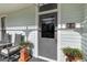 Close-up of the front porch area, highlighting the door, planters, and seating at 206 S Salem St, Apex, NC 27502