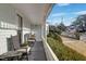 Inviting front porch featuring rocking chairs with an open view at 206 S Salem St, Apex, NC 27502