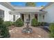 Beautiful home exterior with manicured landscaping, a fountain, and a welcoming porch at 206 S Salem St, Apex, NC 27502