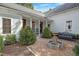 Beautiful home exterior with manicured landscaping, a fountain, and a welcoming porch at 206 S Salem St, Apex, NC 27502