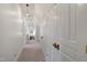 Upper level hallway illuminated by pendant lighting and featuring ample closet space at 206 S Salem St, Apex, NC 27502