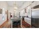 Open kitchen featuring a large island, stainless steel appliances, and custom cabinetry at 206 S Salem St, Apex, NC 27502