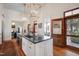 Stylish kitchen with island, pendant lights, stainless appliances and eat in bar at 206 S Salem St, Apex, NC 27502
