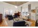 Inviting living room with hardwood floors, natural light, and comfortable, stylish furnishings at 206 S Salem St, Apex, NC 27502