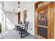 Charming front porch with rocking chairs and views of the neighborhood and entry door at 206 S Salem St, Apex, NC 27502