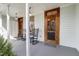 Charming front porch with rocking chairs and views of the neighborhood and entry door at 206 S Salem St, Apex, NC 27502