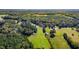 This aerial view highlights the property, bordering mature trees and pastures at 220 Epps Clark Rd, Siler City, NC 27344