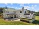 Backyard featuring multiple decks and lush greenery, perfect for outdoor living and relaxation at 220 Epps Clark Rd, Siler City, NC 27344
