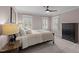 Comfortable bedroom with plush carpeting, natural light, black dresser, and tray ceiling at 220 Epps Clark Rd, Siler City, NC 27344