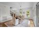 Dining room with hardwood floors, an elegant chandelier, and natural light at 220 Epps Clark Rd, Siler City, NC 27344
