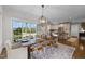 Open concept dining room with views to the kitchen and sliding door access to the outdoors at 220 Epps Clark Rd, Siler City, NC 27344