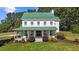 Captivating home boasting a charming front porch, a lush front lawn, and a stately green roof at 220 Epps Clark Rd, Siler City, NC 27344