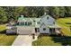 Charming home boasting a spacious garage, inviting porch, and well-maintained landscaping at 220 Epps Clark Rd, Siler City, NC 27344