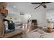 Bright living room with hardwood floors, fireplace, and ample natural light beaming through the double windows at 220 Epps Clark Rd, Siler City, NC 27344