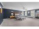 Spacious main bedroom with dark accent wall, tray ceiling, nightstands, bench, and plantation shutters at 220 Epps Clark Rd, Siler City, NC 27344