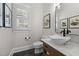 Charming powder room features a vessel sink, marble countertop, and shuttered window at 220 Epps Clark Rd, Siler City, NC 27344