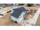 Aerial view showcasing the home's roof, garage, screened porch, and surrounding landscape at 23 Sparkle Ln, Garner, NC 27529