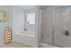 Bright bathroom with large soaking tub and glass shower at 23 Sparkle Ln, Garner, NC 27529