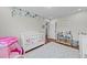 Charming Bedroom featuring a crib, play tent, and decorative wall art at 23 Sparkle Ln, Garner, NC 27529