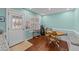 Cozy dining area features a round table and bench seating with natural light from the door at 23 Sparkle Ln, Garner, NC 27529