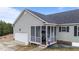 Charming home featuring a screened porch, garage, and manicured lawn at 23 Sparkle Ln, Garner, NC 27529