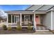 Inviting front porch with rocking chairs, perfect for relaxing and enjoying the outdoors at 23 Sparkle Ln, Garner, NC 27529