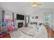 Bright living room featuring a fireplace, vaulted ceilings, and cozy decor at 23 Sparkle Ln, Garner, NC 27529